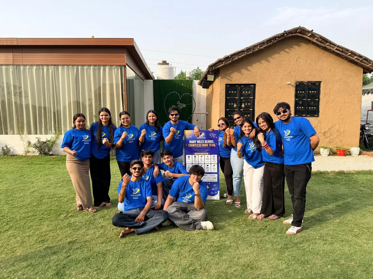 The 99Birds team in branded blue t-shirts